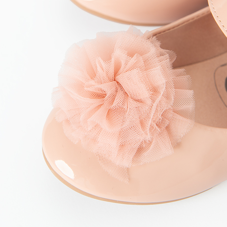 Pink ballerinas with pom pom