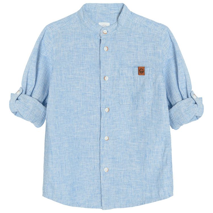 Light blue denim long sleeve button down shirt that rolls up to a button