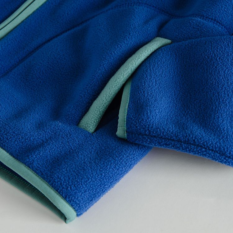 Blue zip through sweatshirt with green finishes