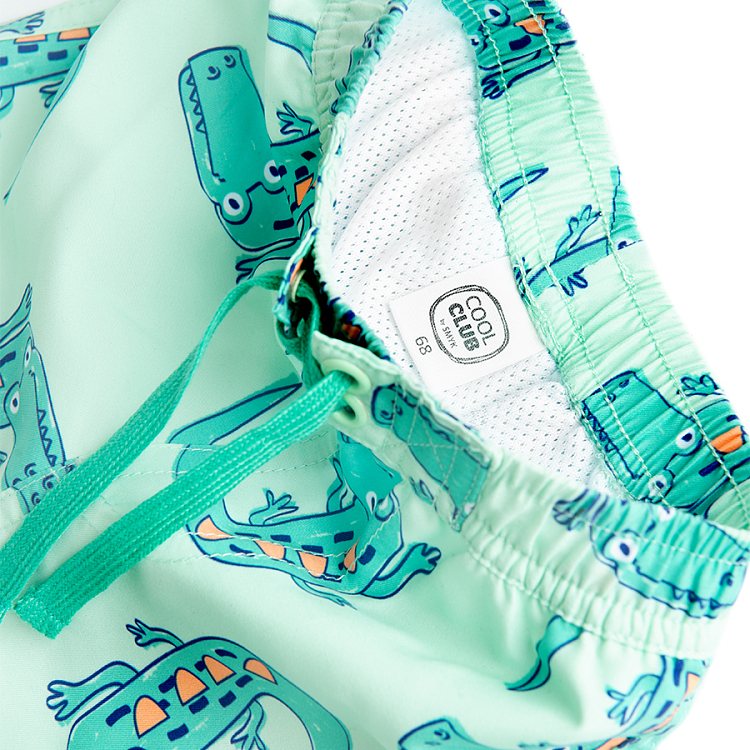 Lime swim trunks with crocodiles print