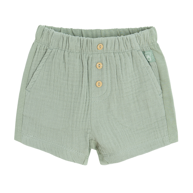 Khaki shorts with buttons in the middle