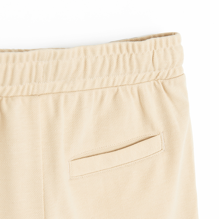 Beige shorts with cord on waist