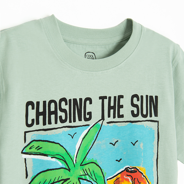 Green T-shirt with Chasing the Sun print