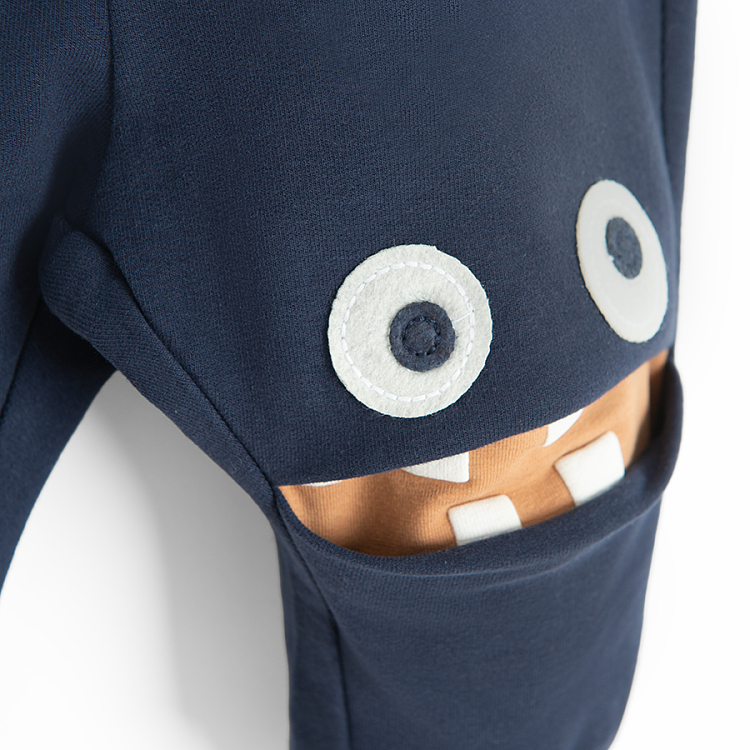 Dark blue jogging pants with monster face on the knees print