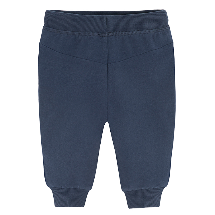 Dark blue jogging pants with monster face on the knees print