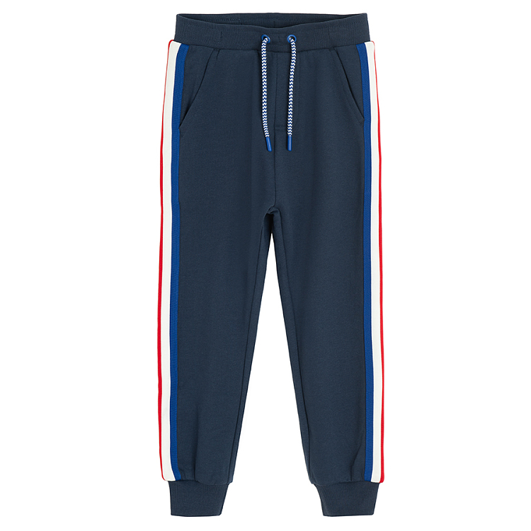 Blue jogging pants with white and red stripes on the side Coolclub