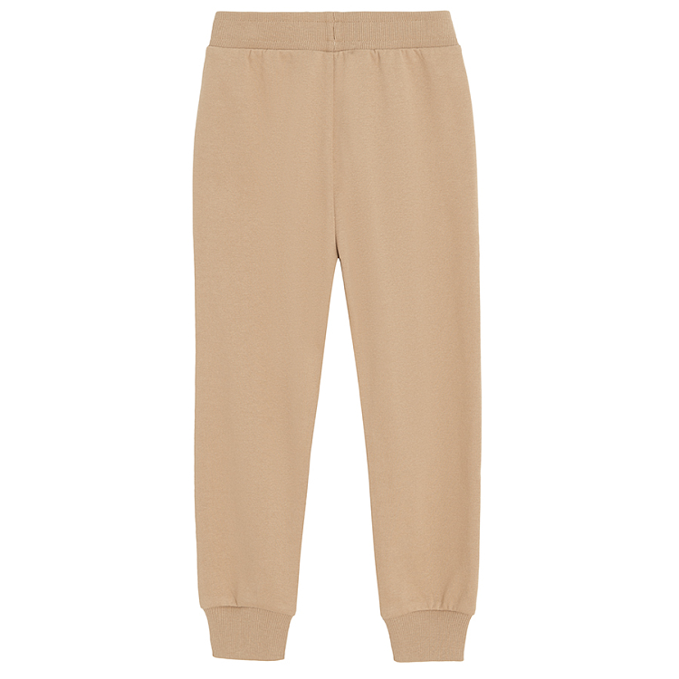 Brown jogging pants with corded waist and elastic around the ankles