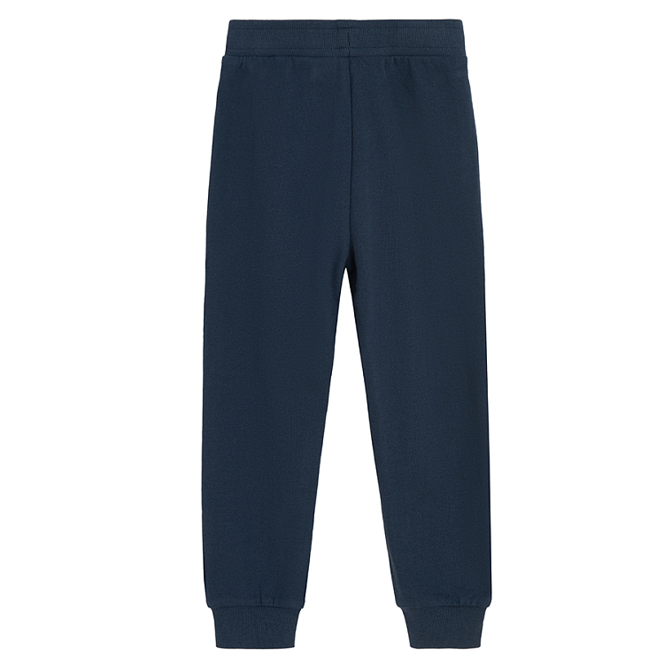 Blue jogging pants with corded waist and elastic around the ankles