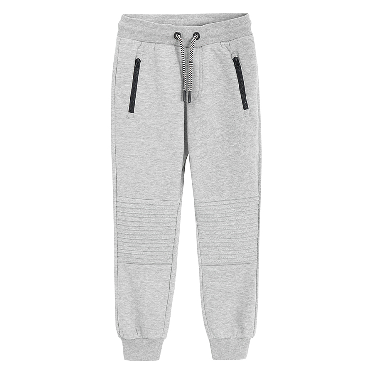 Grey jogging pants with design on the knees