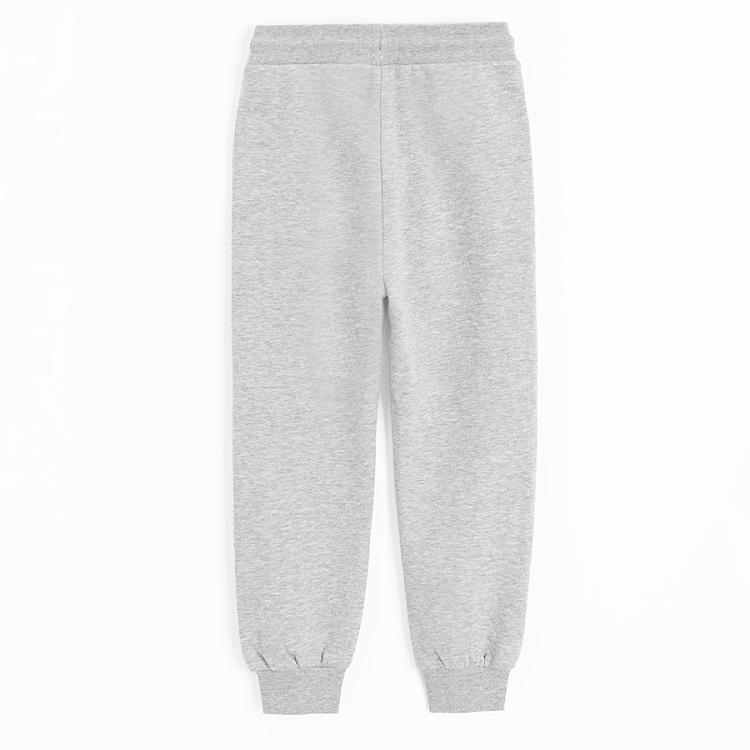 Grey jogging pants with design on the knees