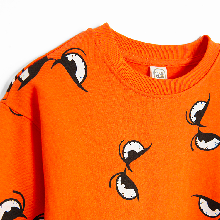 Orange sweatshirt with eyes print