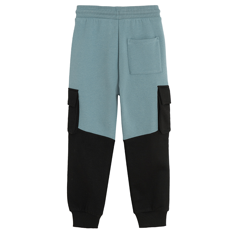 Black and blue jogging pants with external side pockets