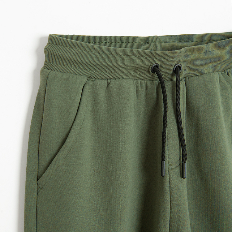 Khaki jogging pants with external side pockets