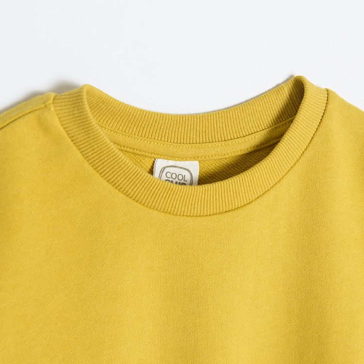 Yellow sweatshirt