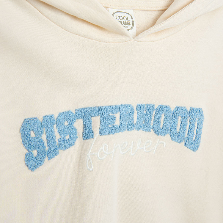 White hooded sweatshirt with 'SISTERHOOD' print