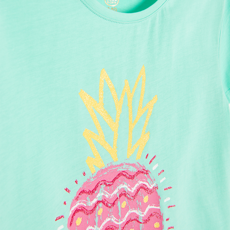 Turquoise T-shirt with purple pineapple print