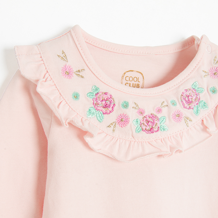 Pink long sleeve bodysuit with embroidery around the neckline