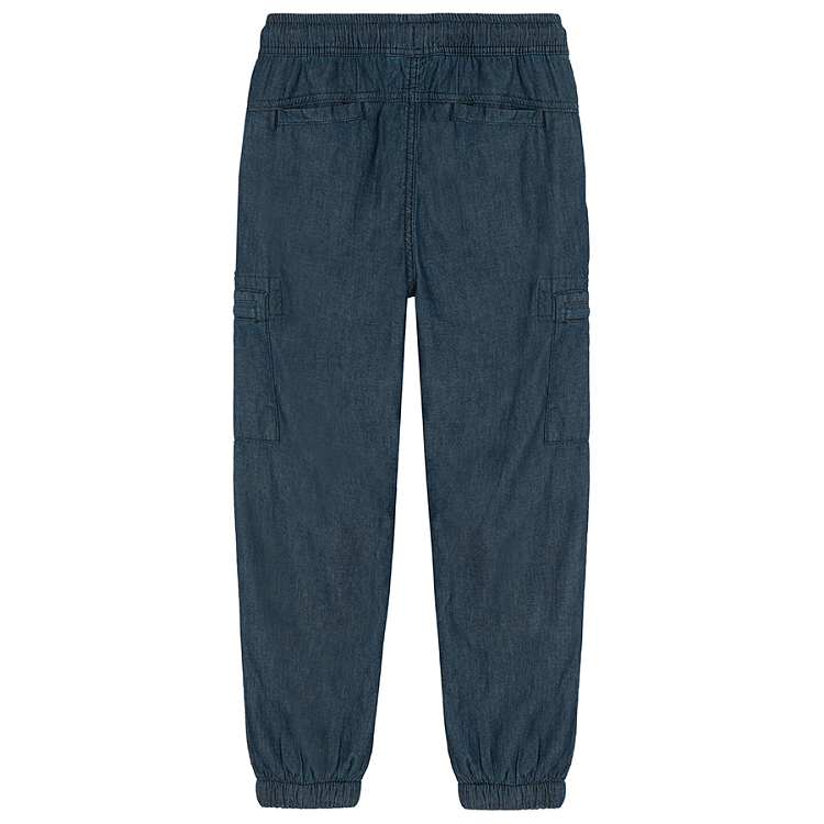 Blue denim pants with external side pockets