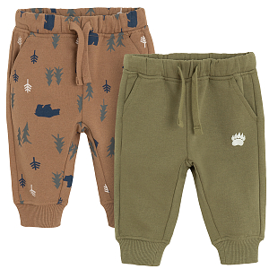 Brown and green jogging pants with forest print