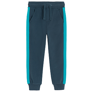 Blue jogging pants with light blue stip on the side