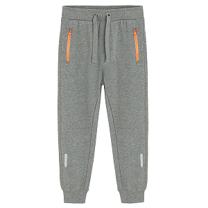 Grey jogging pants with orange details