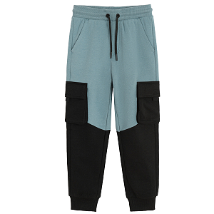 Black and blue jogging pants with external side pockets