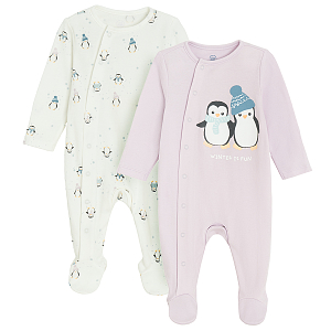 White and purple footed overalls with penguin print and side buttons