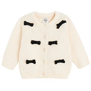 White cardigan with black bows