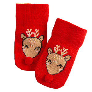 Red socks in box with Santa Claus pattern