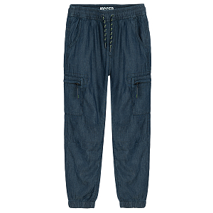 Blue denim pants with external side pockets