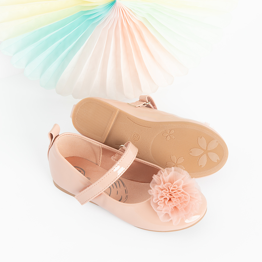 Pink ballerinas with pom pom