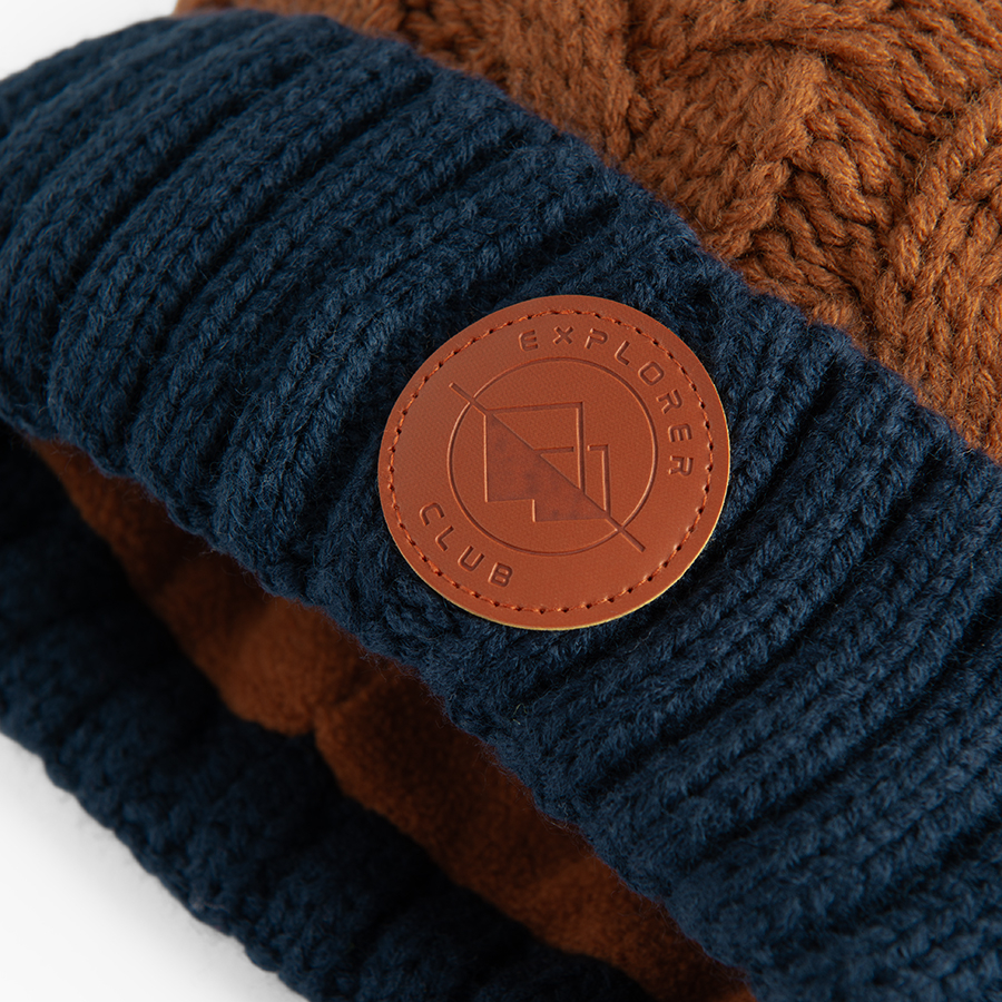 Brown and blue beanie with pom pom