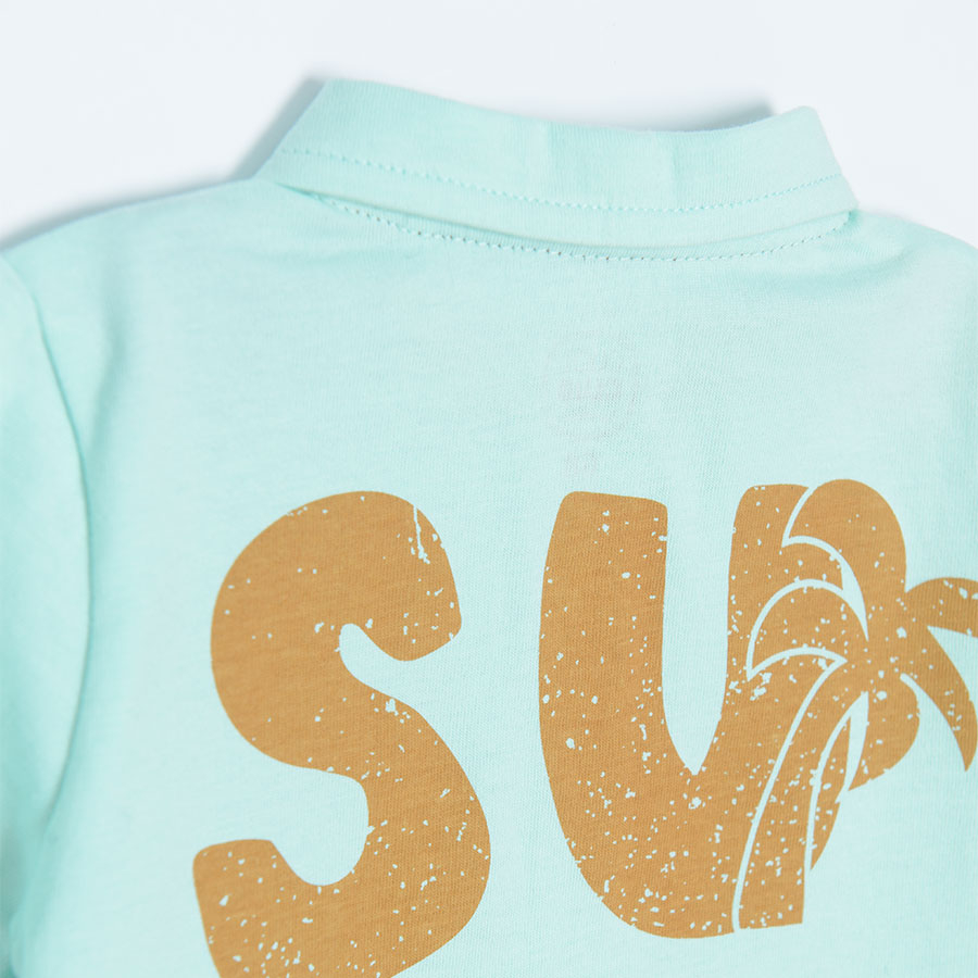 Turquoise polo short sleeve T-shirt with palm tree and SURF print on the back