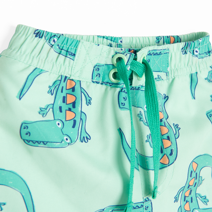 Lime swim trunks with crocodiles print