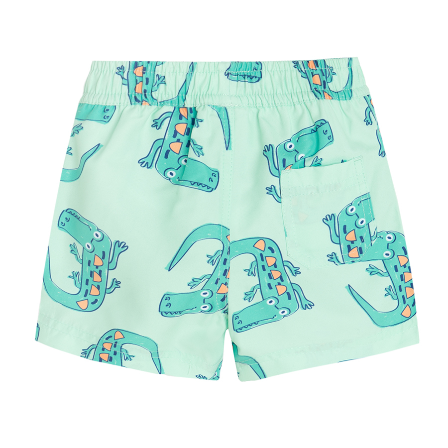 Lime swim trunks with crocodiles print