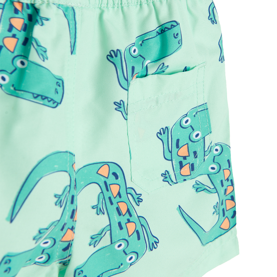 Lime swim trunks with crocodiles print