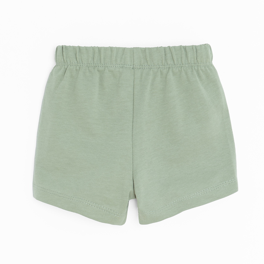 Khaki shorts with buttons in the middle