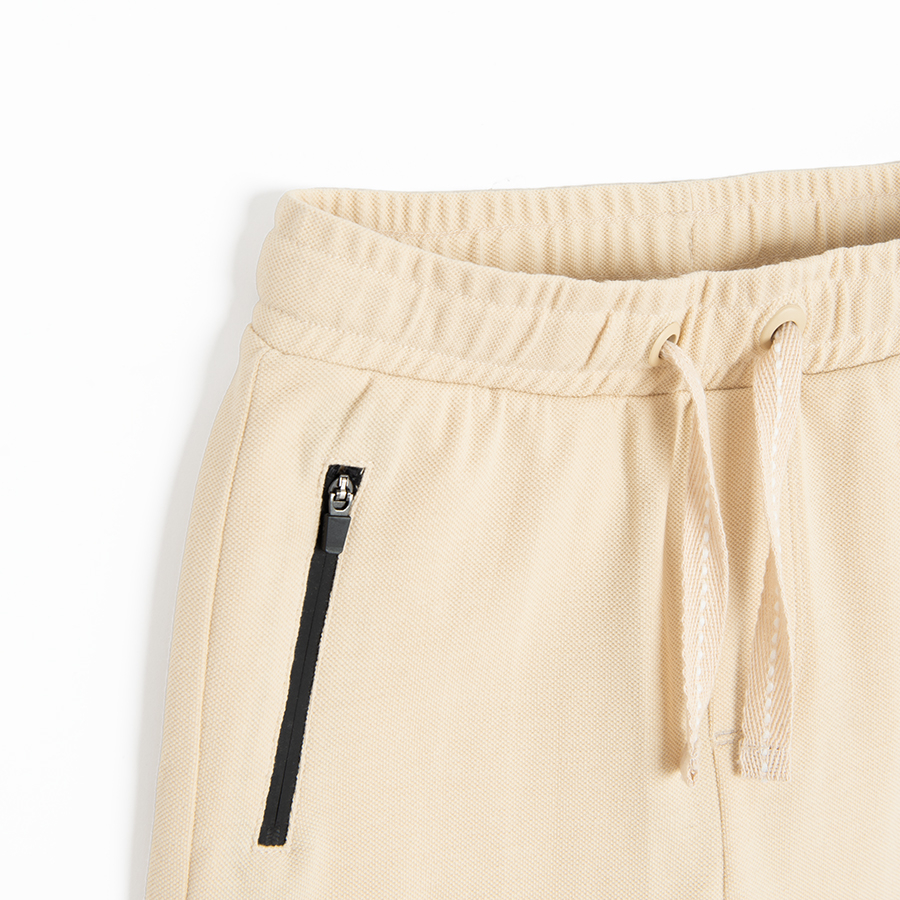 Beige shorts with cord on waist