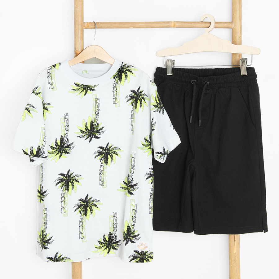 White T-shirt with palm trees and black shorts