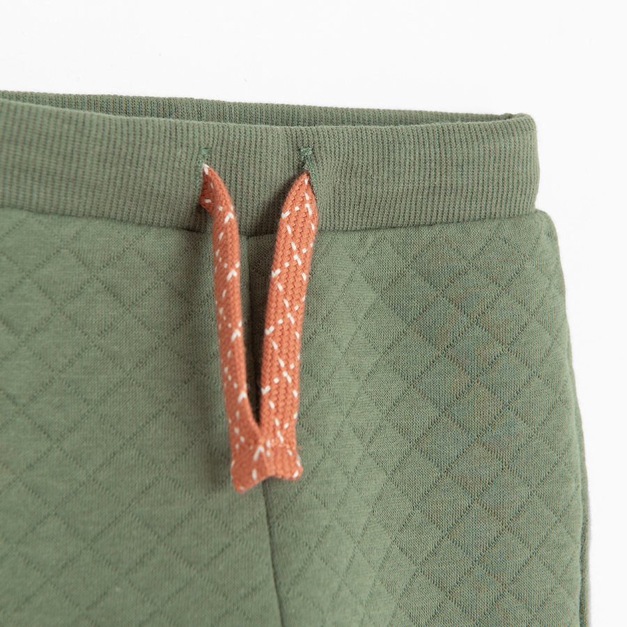 Green jogging pants