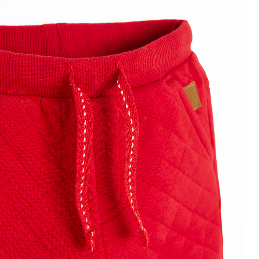 Red quilted jogging pants