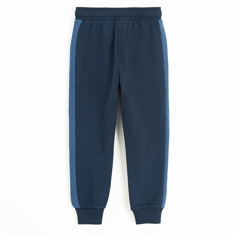 Blue sweatpants with stripe on the side and cord