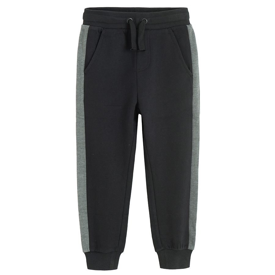 Black sweatpants with grey strip on the side