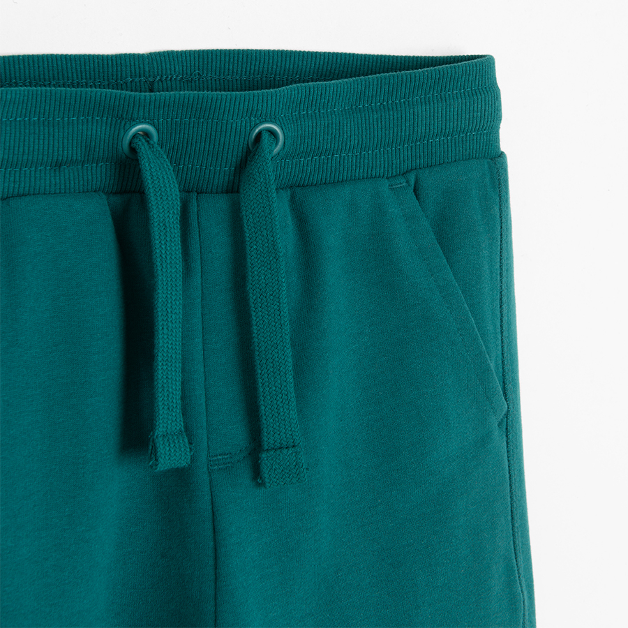 Green jogging pants