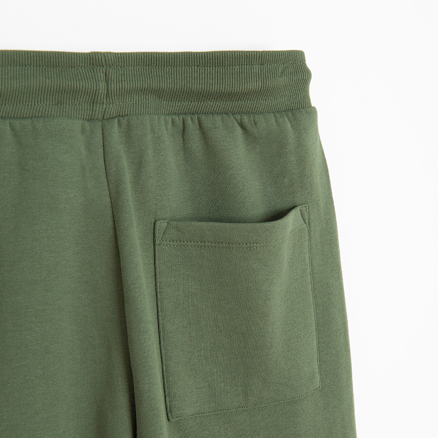 Khaki jogging pants with external side pockets