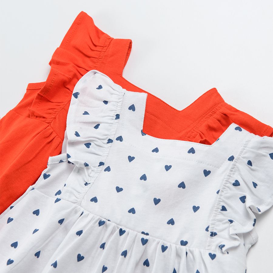 Red sleeveless and ruffle dress and white with blue hearts dress 2-pack