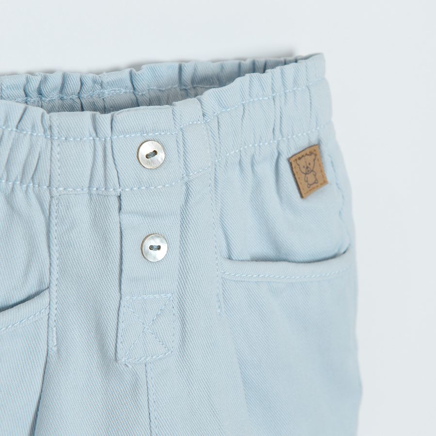 Cream denim trousers with elastic waistband and buttons