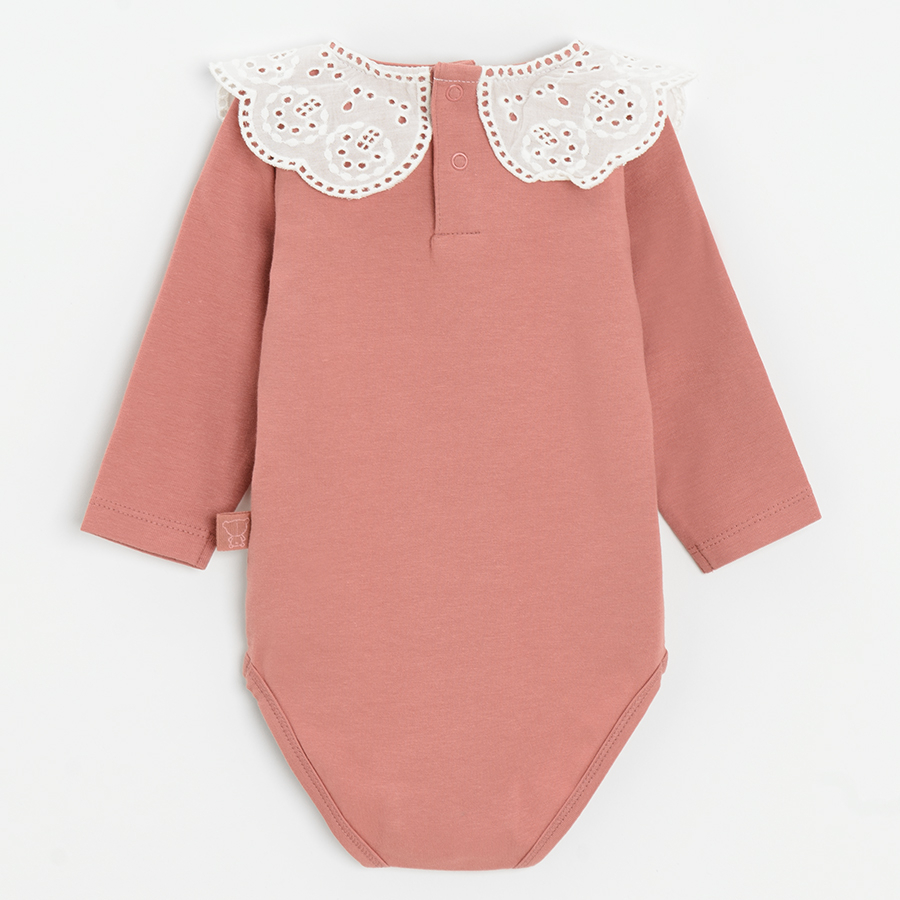 Pink long sleeve bodysuit with white collar