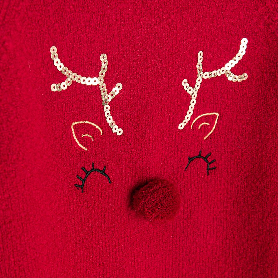 Red sweater with raindeer print