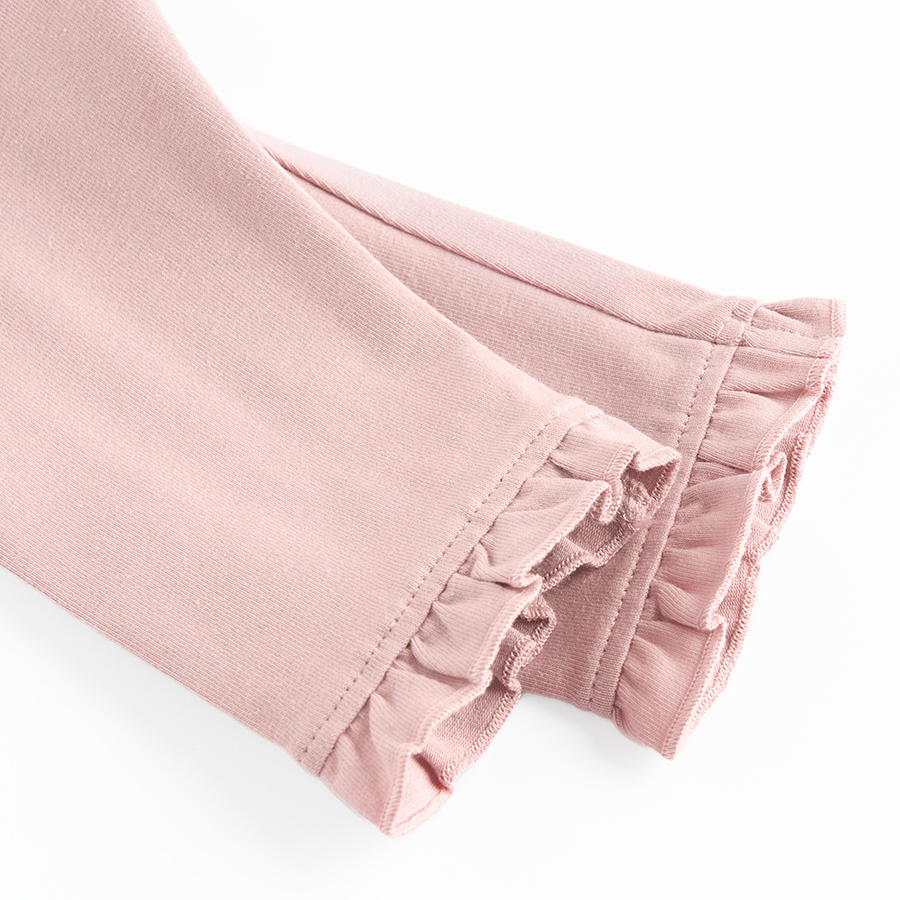 Pink leggings with ruffles at the bottom